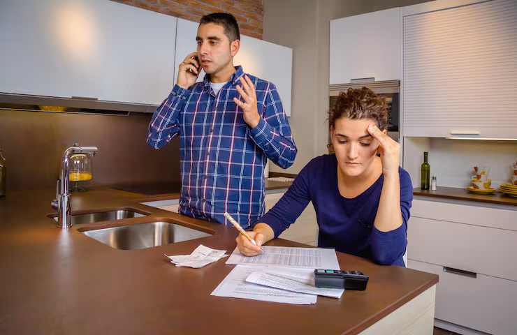 Remodeling Mistakes couple discussion in budget